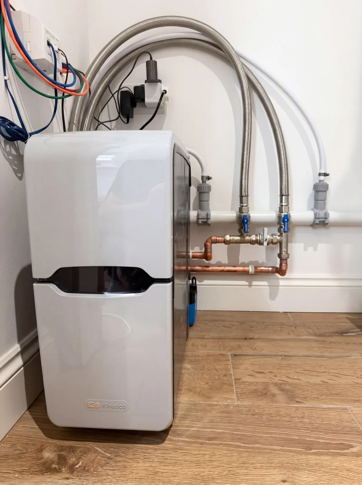 Kinetico block-salt water softener installed in an airing cupboard in Chandlers Ford